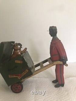 1920 STRAUSS TIN TOY RED CAP PORTER With DOG POPPING OUT OF TRUNK