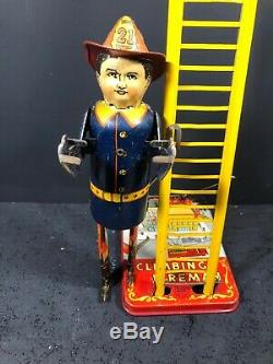 1930s MARX Smokey Joe Fireman Climbing Ladder Wind Up Tin Toy