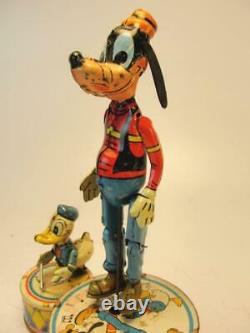1945 Louis Marx Co. Walt Disney Donald Duck Duet Tin Wind Up Jigger Toy Goofy