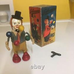 4SCHUCO WIND-UP JUGGLING CLOWN NR. 965 WithREPRO. BOX AND KEY. FULLY OPERATIONAL