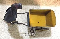 Antique Black Americana Wind Up Toy Man Pushing Cart By Strauss Original Paint
