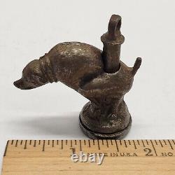 Antique Dog Taking A Poop Crap Dump Cap Bomb String Toy Noisemaker Metal