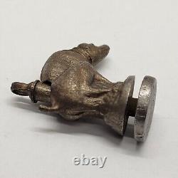 Antique Dog Taking A Poop Crap Dump Cap Bomb String Toy Noisemaker Metal