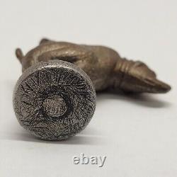 Antique Dog Taking A Poop Crap Dump Cap Bomb String Toy Noisemaker Metal