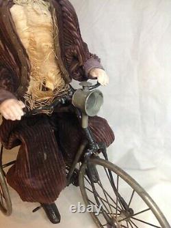 Antique French F. G. Wind Up Mechanical Doll riding Tricycle