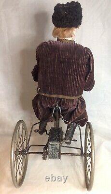 Antique French F. G. Wind Up Mechanical Doll riding Tricycle