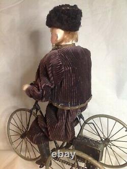 Antique French F. G. Wind Up Mechanical Doll riding Tricycle