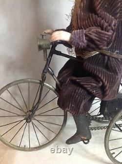 Antique French F. G. Wind Up Mechanical Doll riding Tricycle