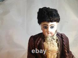 Antique French F. G. Wind Up Mechanical Doll riding Tricycle