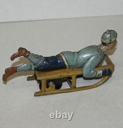 Antique Hess German Toy Tin Wind Up Boy on Sled