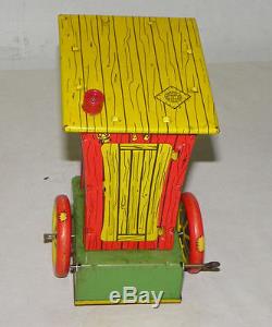 Antique Tin Wind Up Humphrey Mobile Toy by Wyandotte Toys