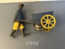 Antique Tip-Tip Black Porter Pushing Wheelbarrow Strauss Co. Wind-Up Toy