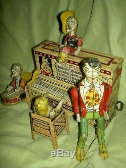 Antique, Unique Art Mfg. Co. Li'l Abner Dogpatch Band tin working wind-up toy