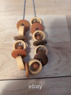 Bakelite Crib Toy. Circles Balls Discs Brown Amber Yellow Rare