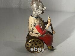 C. 1900 German Gunthermann Tin Windup Seated Clown Clarinet Player Painted Toy