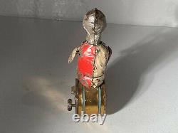 C. 1900 German Gunthermann Tin Windup Seated Clown Clarinet Player Painted Toy