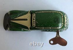 C. 1930's Marx Tricky Taxi Lithographed Tin Wind-up Car Looks & Works Great