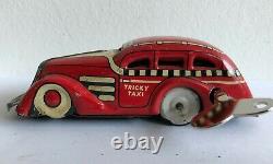 C. 1930's Marx Tricky Taxi Lithographed Tin Wind-up Car Red Version