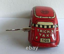 C. 1930's Marx Tricky Taxi Lithographed Tin Wind-up Car Red Version