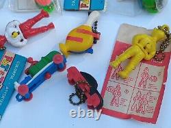Collection Of 9 Vtg Keychain Puzzles. Hot Rod, Shmoo, Cars And More