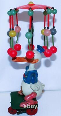 EX! DISNEY 1930s CELLULOID DONALD DUCK CAROUSEL ON TIN WIND-UP CART-24 BALL VERS