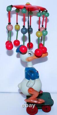 EX! DISNEY 1930s CELLULOID DONALD DUCK CAROUSEL ON TIN WIND-UP CART-24 BALL VERS