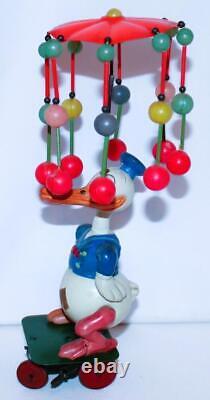 EX! DISNEY 1930s CELLULOID DONALD DUCK CAROUSEL ON TIN WIND-UP CART-24 BALL VERS