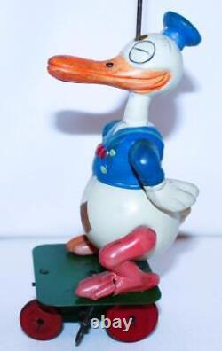 EX! DISNEY 1930s CELLULOID DONALD DUCK CAROUSEL ON TIN WIND-UP CART-24 BALL VERS