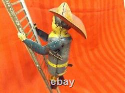 Fireman climbing the ladder, Antique wind up toy from1930s, Made by MARX Of NY