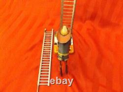 Fireman climbing the ladder, Antique wind up toy from1930s, Made by MARX Of NY