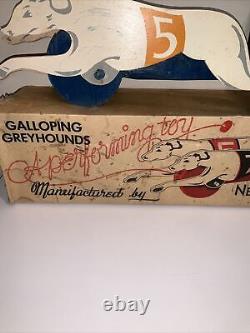 Galloping Greyhounds A Performing Toy By New Enterprises Winston-salem, N. C