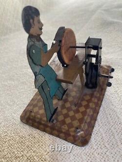 Girard 1930s Tin Litho Wind-up Flasho the Grinder with Key
