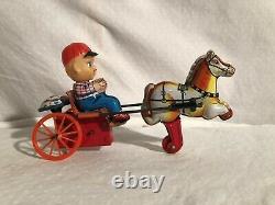 Kanto Celluloid Tin and Plastic Wind Up Toy Boy with Wagon Horse Sulky Japan