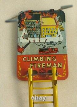 Louis Marx & Co. Smokey Joe climbing firefighter vintage wind up tin toy