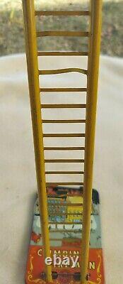 Louis Marx & Co. Smokey Joe climbing firefighter vintage wind up tin toy