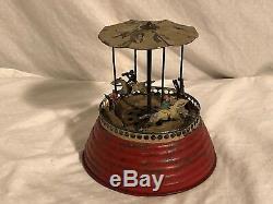 MUSICAL CAROUSEL Hand Painted Tin and Lead Clockwork Toy Early German Guntherman