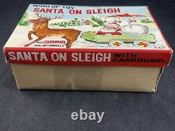 O. K. D Tinplate Wind-up Toy SANTA ON SLEIGH CARROUSEL with Box Made in Japan WORKS