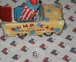 Old Vintage Wakasuto Toys Japan Bump Car with Pop Up Clown Fiction Tin Litho Car