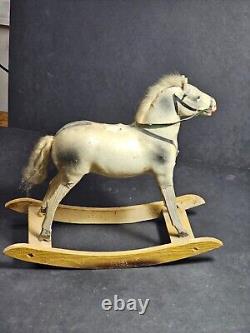 Outstanding late 1890s rocking horse toy, wood frame and composition body