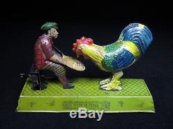 Pre-war Japan 7 ¼ Vintage Tin Mechanical Wind-up Boy Feeding Chicken Toyodo