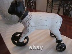 Primitive Toy Wood Cow On 3 Metal Wheels Marked 2a13 10 1/2 Long 9 1/2 Tall