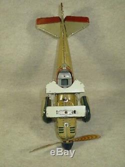 Tippco Tipp & Co clockwork airplane drops 4 2-piece cap bombs, box, pilot, works