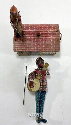 Unique Art Tin Litho Windup Jazzbo Jim Dancer on Roof withBoy Violin Player