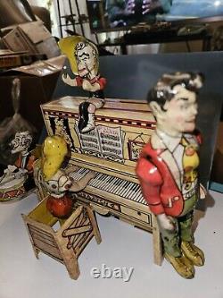 Unique Art Tin Wind-up Li'l Abner and his Dog patch Band