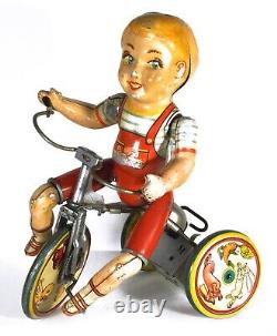 Unique Art Tin Wind-up Toy Kiddy Cyclist Boy on Tricycle (Circa 1940's)