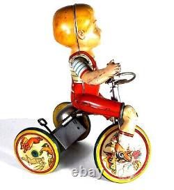 Unique Art Tin Wind-up Toy Kiddy Cyclist Boy on Tricycle (Circa 1940's)