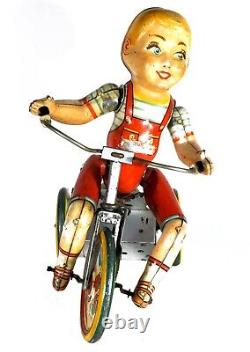 Unique Art Tin Wind-up Toy Kiddy Cyclist Boy on Tricycle (Circa 1940's)