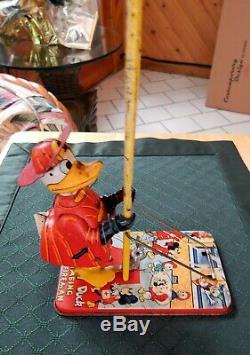 VINTAGE DISNEY 1950's DONALD DUCK CLIMBING FIREMAN TIN WIND UP TOY- BY LINE MAR