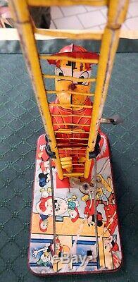VINTAGE DISNEY 1950's DONALD DUCK CLIMBING FIREMAN TIN WIND UP TOY- BY LINE MAR