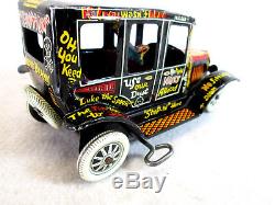 Vintage 1950's Marx tin lithographed wind up old jalopy toy car works